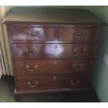 A MAHOGANY CHEST OF DRAWERS, with two short above three longer graduated drawers, original brass ha