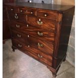 A LARGE 19TH CENTURY MAHOGANY CHEST OF DRAWERS, having three small frieze drawers, then two short a