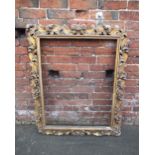 A 19TH CENTURY GILTWOOD FLORENTINE STYLE PICTURE FRAME, of rectangular outline, rebate 88.5 x 68 cm