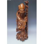 A CARVED HARDWOOD CHINESE 'STAR GOD' DEITY 'SHOU LAO', the symbol of longevity recognized by his hi