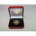 A CASED POBJOY MINT 2008 YELLOW METAL SIERRA LEONE $50 DOLLAR COIN, with inset diamond, ruby and sa