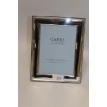 A BOXED HALLMARKED SILVER PICTURE FRAME