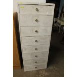 A TALL MODERN EIGHT DRAW CHEST OF DRAWERS