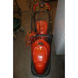 TWO ELECTRIC FLYMO LAWN MOWERS