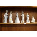 A COLLECTION OF LLADRO STYLE FIGURES TOGETHER WITH A REGAL FIGURE OF A LADY