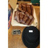 A FUR STOLE TOGETHER WITH A BOWLER HAT AND A PAIR OF OPERA GLASSES