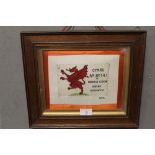 A FRAMED WORLD WAR ONE SILK OF PATRIOTIC PICTURE DEPICTING A RED DRAGON AND THE LEGEND 'CYMRU AM