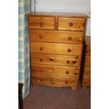 A TWO OVER FIVE PINE CHEST OF DRAWERS