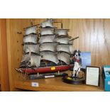 A ROYAL MINT LIMITED EDITION FIGURE OF LORD NELSON TOGETHER WITH A MODEL OF A SHIP