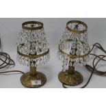 A PAIR OF BRASS TABLE LAMPS WITH GLASS DROPLET DECORATION
