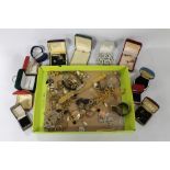 A TRAY OF VINTAGE COSTUME JEWELLERY, to include brooches, earrings, etc