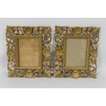 A PAIR OF SMALL DECORATIVE GILT PICTURE FRAMES A/F, 25 cm X 21 cm frame, aperture 14 cm x 10 cm (44