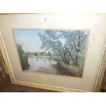 A FRAMED AND GLAZED PASTEL OF A WATERSIDE SCENE BY JUNE CLAYTON