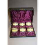 A CASED SET OF SIX NAPKIN RINGS