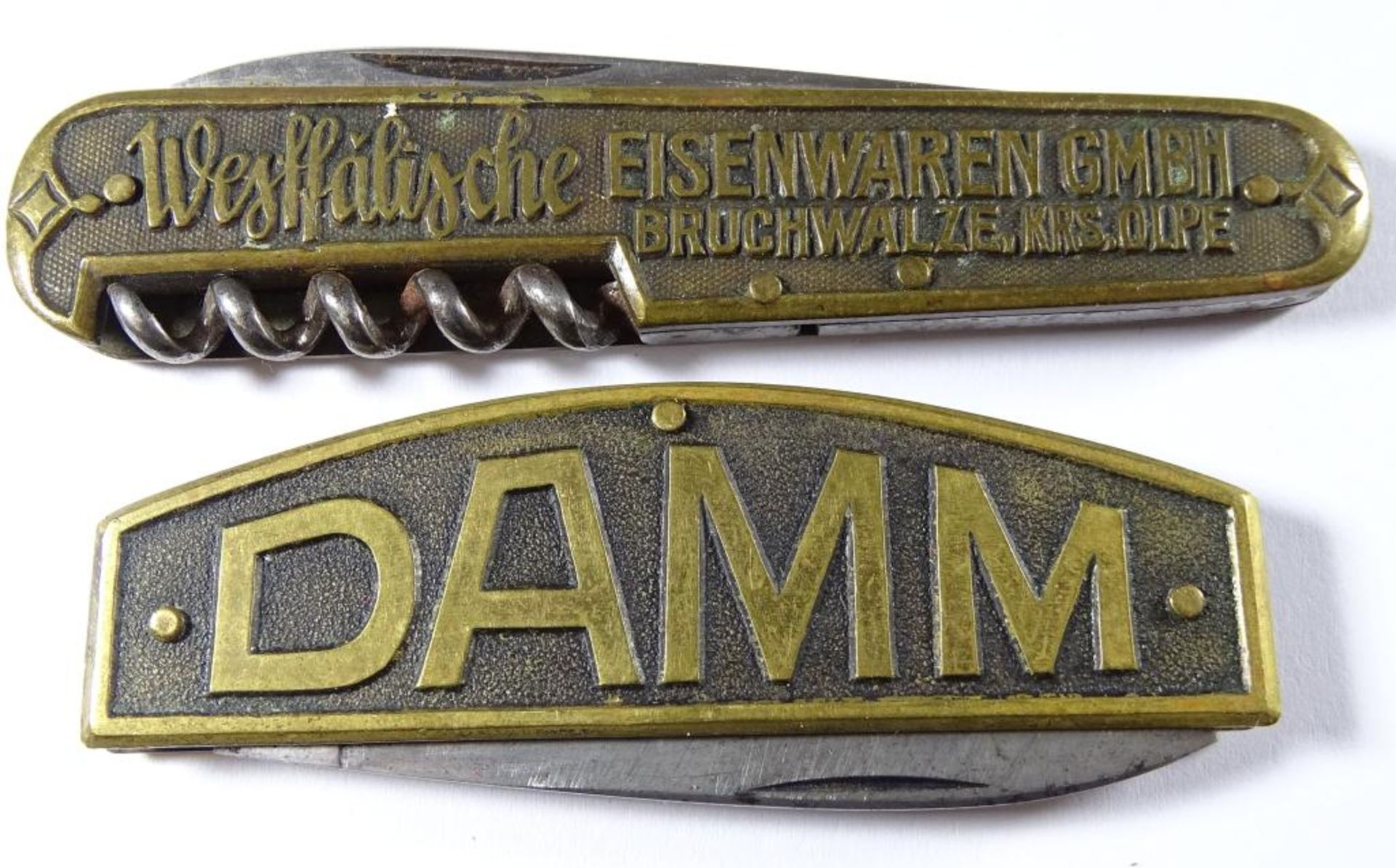 Zwei Taschenmesser,Messinggehäuse,"Damm","Eisenwaren GmbH