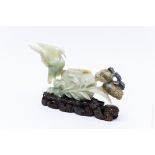 Mottled Green Carved Jade Figure.