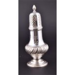 A Victorian silver sugar caster having spiral finial, the lid with pierced and engraved