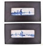 A pair of late 19th century Delft framed plaques decorated with boating scenes and windmills, signed