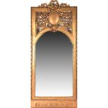 A 19th century gilt gesso pier mirror the pierced top decorated with ribbons, scrolls and flowers,