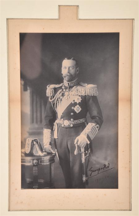 Framed three quarter length portrait of King George V (1865-1936) in full naval uniform dated 1911-