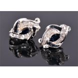 A pair of 14 carat white gold, diamond, and sapphire cluster ear studs, set marquise and calibiri