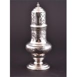 A George III silver sugar caster hallmarked London 1783, with pierced top, and engraved baluster