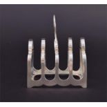 An Edwardian silver four division toast rack hallmarked Sheffield 1909, makers mark for Harrison