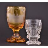 A mid 19th century amber glass spa goblet with acid etched engraved decoration depicting scenes of