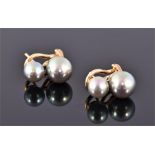 A pair of yellow metal and South Sea black pearl earrings, each set two graduated pearls. L: 1.5cm