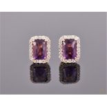 A pair of yellow metal, amethyst, and diamond rectangular cluster ear studs, the butterflies stamped