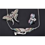 A silver and plique a jour style bird pendant, set with marcasite, suspended small pearl, on a