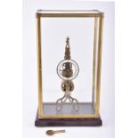 A contemporary brass skeleton clock the scissor-shaped frame, with open white enamel dial and