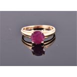 A 14 carat yellow gold and ruby ring, set single round cut ruby of approx. 1.50 carats. Size: P 1/2