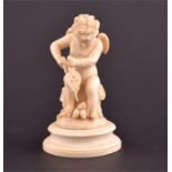 A 19th century European carved ivory figure of cupid blowing the flames on a pair of hearts,