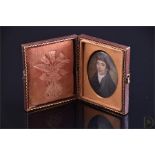 An early 19th century oval portrait miniature of a gentleman in Georgian period dress oil on