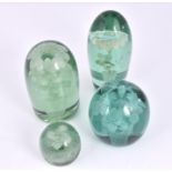 Three Victorian green glass 'dump' paperweights, with floral designs, together with a smaller