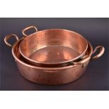 A Victorian copper preserves pan of circular form with iron ring and rolled edge, copper riveted