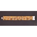 An early 20th century Persian hand painted bracelet with nine mother of pearl and resin panels