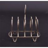 An Edwardian silver four division heart-shaped toast rack hallmarked Birmingham 1904, makers mark