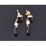 A pair of 18 carat yellow gold, black onyx, and pearl drop earrings. L: 3.1cm