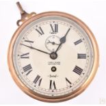 A Sestrel ships brass bulkhead clock the cream dial with black Roman numerals and signed F.