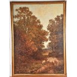 A large framed late 19th century landscape showing a man droving sheep along a wooded path, oil on