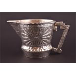 A large 20th century Peruvian .925 Sterling silver jug with embossed Inca style sunburst