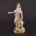 A 19th century Continental porcelain figure of a lady with cupid the lady wearing flowing robes,