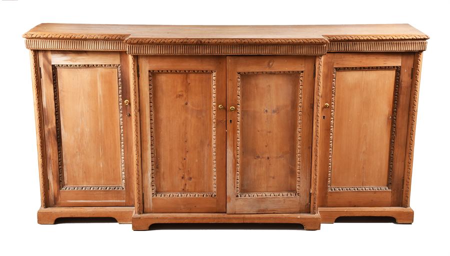 Victorian stained pine breakfront sideboard with carved floral mouldings, four panel doors,