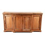 Victorian stained pine breakfront sideboard with carved floral mouldings, four panel doors,