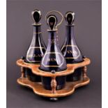 A set of three early 19th century Georgian Bristol blue glass decanters, with lozenge stopper,