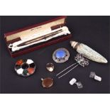 A small collection of silver items and two Scottish brooches.