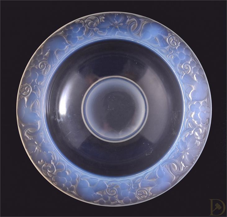 An Art Deco opalescent blue glass circular bowl, by Pierre d'Avesn, the rim decorated with birds