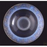 An Art Deco opalescent blue glass circular bowl, by Pierre d'Avesn, the rim decorated with birds